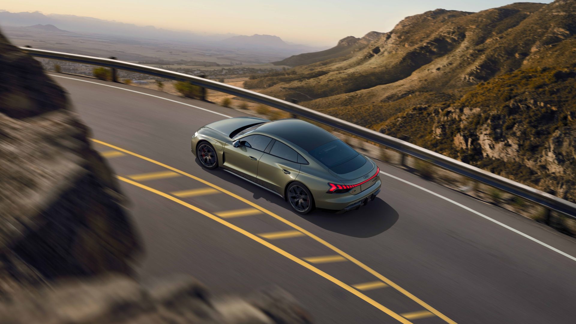 Rear profile view of an RS e-tron GT accelerating.